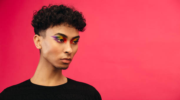 istock Gender fluid male with rainbow eye makeup 1284545836