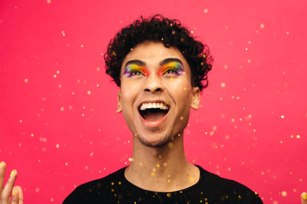 istock Excited gay man throwing glitter 1284545860