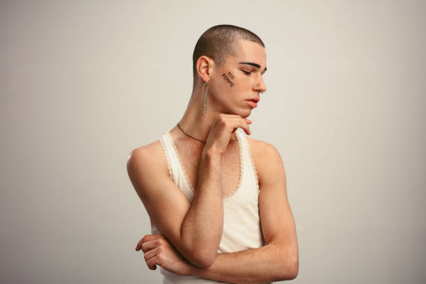 istock Gender fluid man posing in a tank top and earring 1284545948