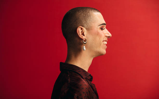 istock Androgynous man wearing earring and makeup 1284547350