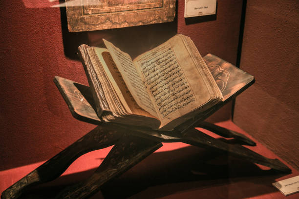Old ancient quran (islam holy book) Old ancient quran (islam holy book) on red light. It's in the Muradiye complex, public and famous place in Tophane district in Bursa, Turkey koran photos stock pictures, royalty-free photos & images