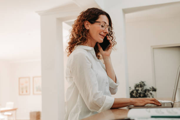 istock Businesswoman sitting at home and working 1284549935