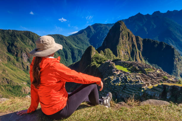 istock Female tourist looking at Machu Picchu 1284550601