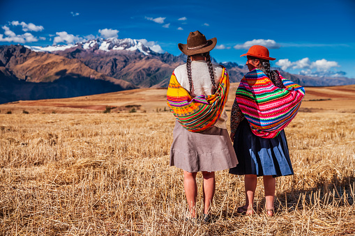 Peruvian women in national clothing admiring view of Andes in The Sacred Valley. The Sacred Valley of the Incas or Urubamba Valley is a valley in the Andes  of Peru, close to the Inca  capital of Cusco and below the ancient sacred city of Machu Picchu. The valley is generally understood  to include everything between Pisac  and Ollantaytambo, parallel to the Urubamba River, or Vilcanota  River or Wilcamayu, as this Sacred river is called when passing through the valley. It is fed by  numerous rivers which descend through adjoining valleys and gorges, and contains numerous  archaeological remains and villages. The valley was appreciated by the Incas due to its special  geographical and climatic qualities. It was one of the empire's main points for the extraction of  natural wealth, and the best place for maize production in Peru.