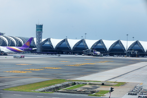 Departure terminal airport Survanabhumi in Bangkok seen from runway
