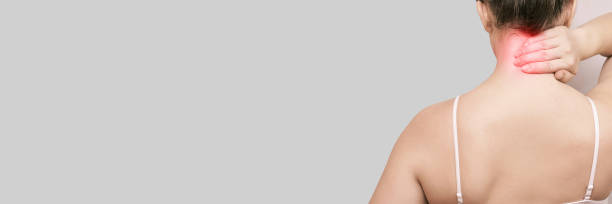 istock Girl hold hand near neck. Back view 1284551077