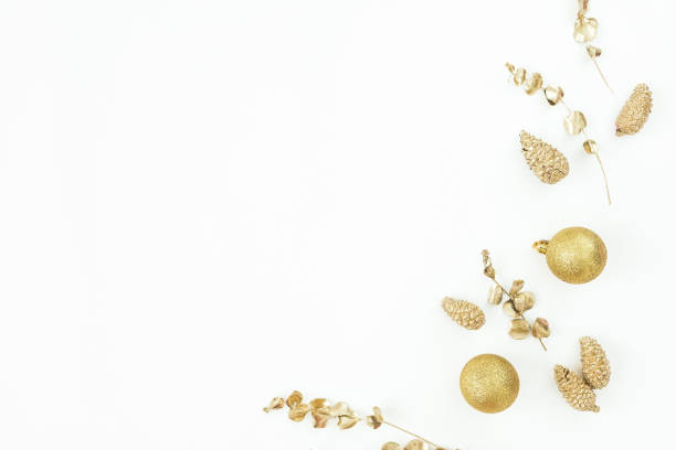 istock Christmas winter composition. Golden decoration on white background. Flat lay, top view. New Year holiday 1284558030