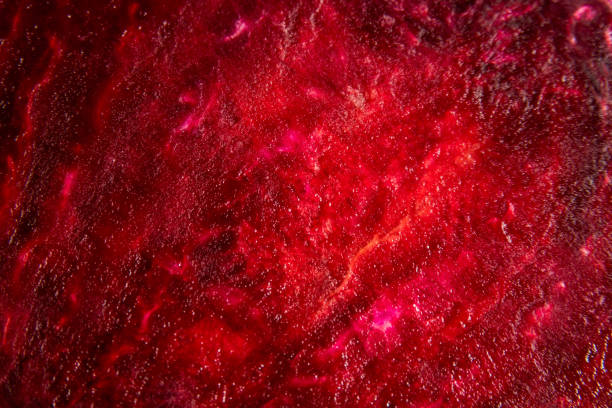 istock Macro background of beetroot sliced on white background 1284560579