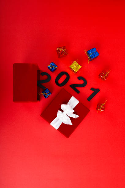 istock New year gift box. Christmas and New Year background flat 1284561364