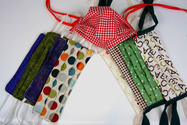 istock Various styles of homemade multicolored cloth face masks 1284561534
