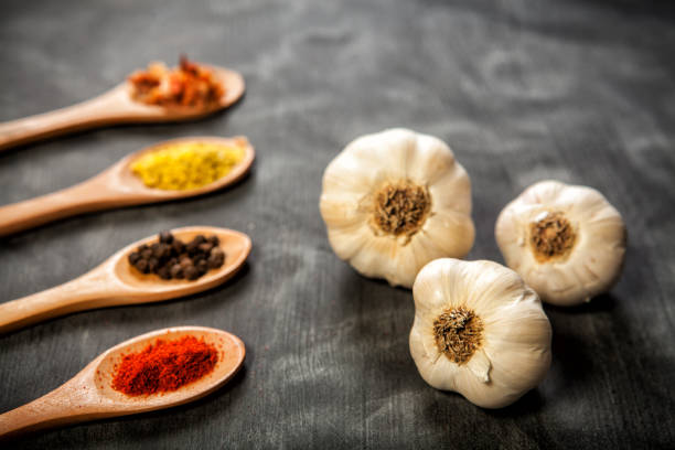 istock Various spice on wooden spoons with herbs 1284563211
