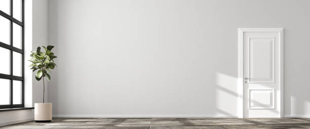 istock Interior scene: nearly empty living room in a loft style building. Bright wall, stone floor, fig tree and white door. 3d render - web banner size. 1284563266