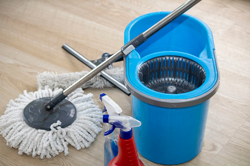 The woman cleans and disinfects household items