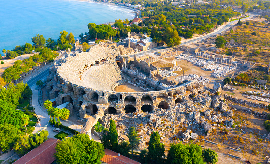 Aerial view of the amphitheater in the ancient Side town, Antalya Province, Turkey. High quality photo