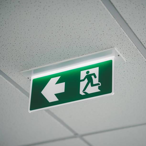 Exit sign. A green emergency exit sign. stock photo