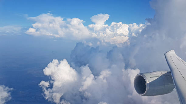 istock Image of cloud formations taken with an aircraft engine from an aircraft window 1284569142