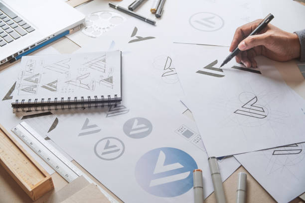 istock Graphic designer creative design sketch drawing logo Trademark brand Workspace 1284570031