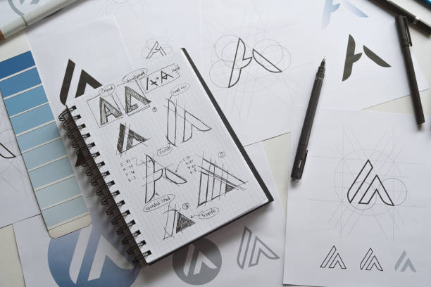 istock Graphic designer creative design sketch drawing logo Trademark brand Workspace 1284570032