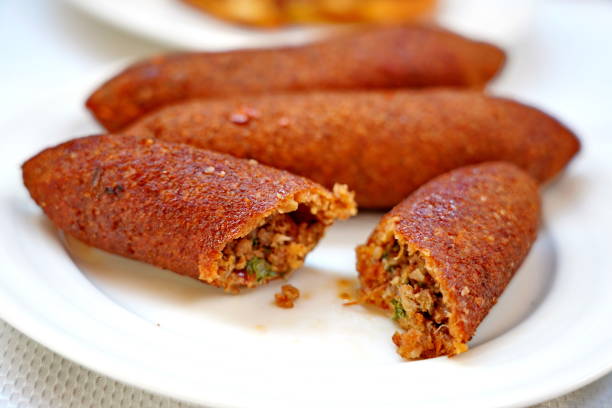 istock traditional Hatay meal oruk (icli kofte) and  tray (tepsi) kebab 1284572672
