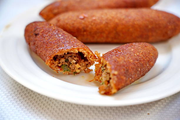 istock traditional Hatay meal oruk (icli kofte) and  tray (tepsi) kebab 1284572673