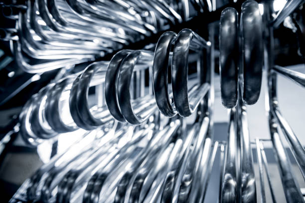 istock Abstract industrial background of metal pipes construction. 1284576956