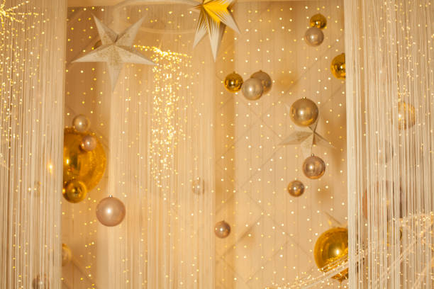 Yellow spheres resting on folds in blue fabric