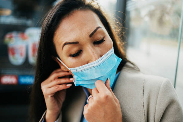 istock Virus infected woman with mask 1284578262