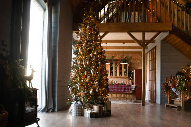 istock Decorated apartment with festive lights, Christmas tree and gift boxes 1284578729
