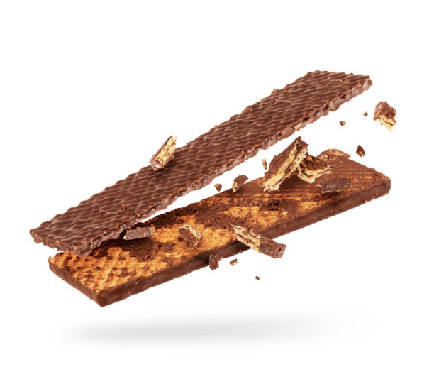 istock Chocolate waffle is breaking into two halves in the air on a white background 1284582985