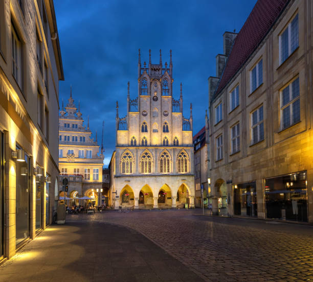 City Hall at dusk in Munster, Germany Munster, Germany. Historical City Hall at dusk munster stock pictures, royalty-free photos & images