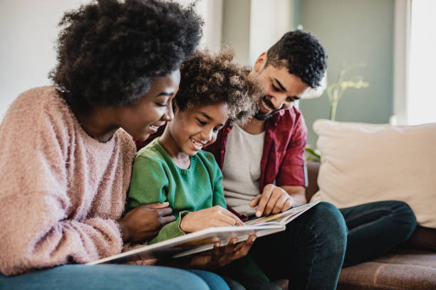 istock African American parents learning with their child at home 1284584612