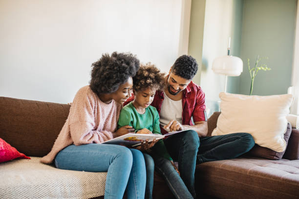 istock African American parents learning with their child at home 1284584674