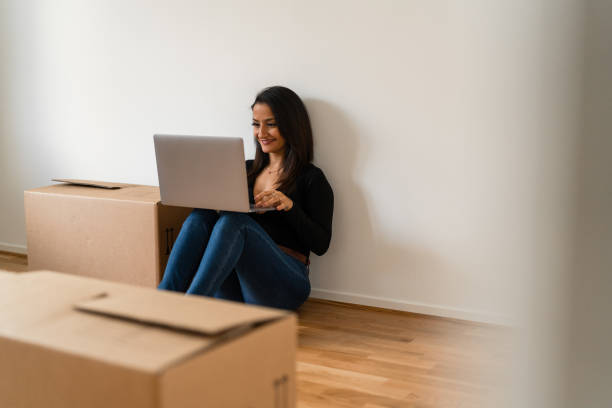 istock Using a laptop in the new apartment 1284588103
