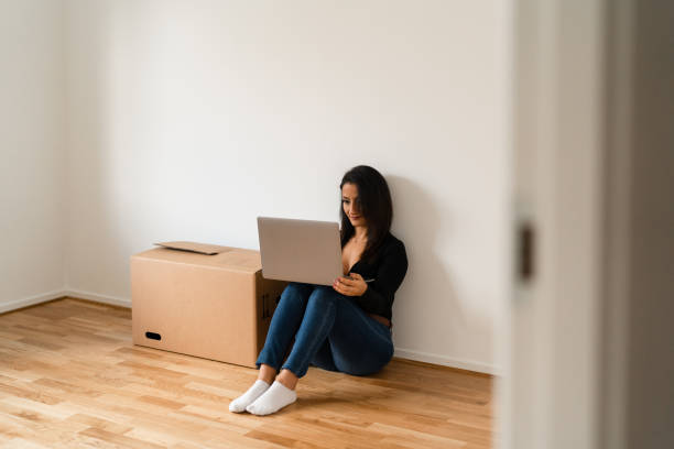 istock Using a laptop in the new apartment 1284588122