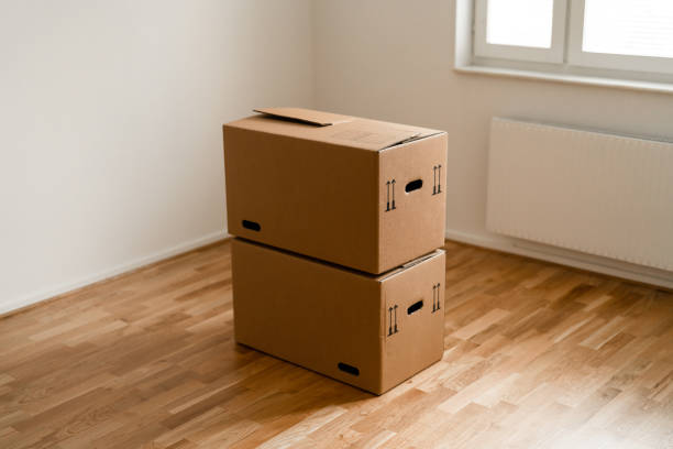 istock Cardboard boxes in the new apartment 1284588123