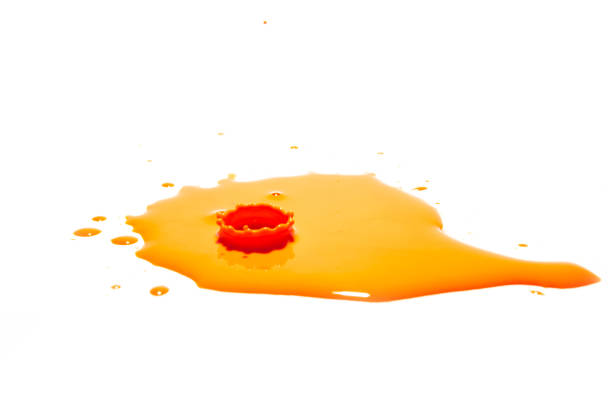 istock Orange water droplets splashing on a white background 1284588266
