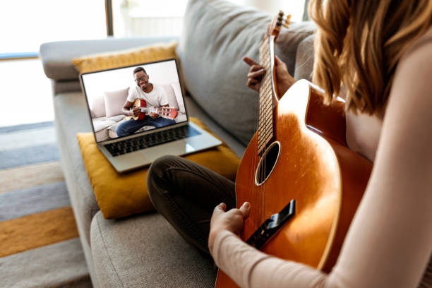 istock Friends playing music together through a video call on the internet 1284589552