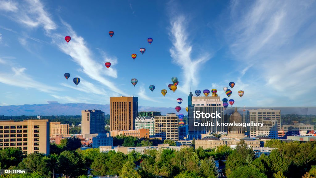 Boise city skyline with hot air balloons and blue sky Cloudy sky over Boise with many hot air balloons Idaho Stock Photo