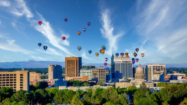 Boise city skyline with hot air balloons and blue sky Cloudy sky over Boise with many hot air balloons idaho stock pictures, royalty-free photos & images