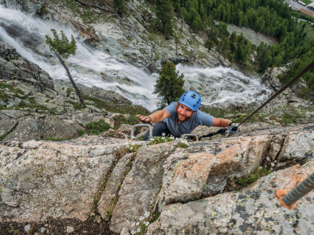 istock Man on Via Ferrata climbing up 1284589706