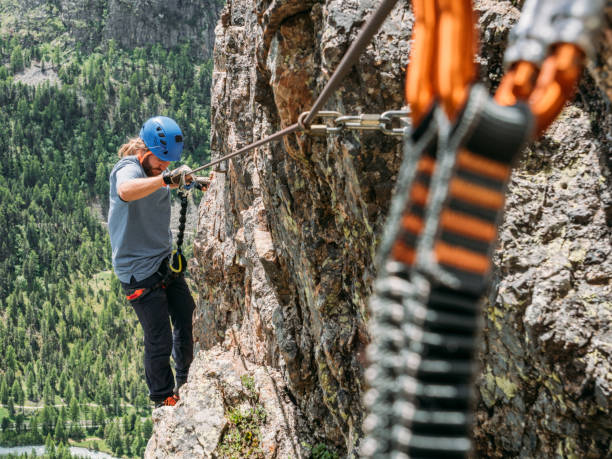 istock Man on Via Ferrata climbing up 1284590018