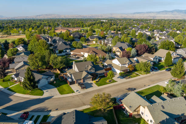 istock Neighborhood with a school and streets with trees 1284590117