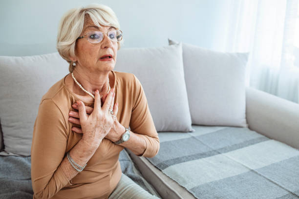 istock Good looking aged woman having heart attack. 1284591383