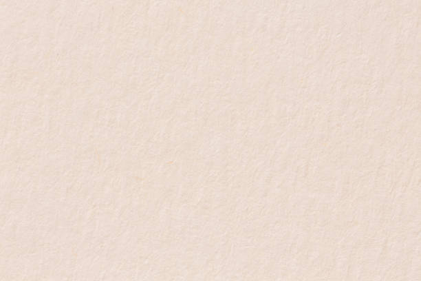 istock Paper texture light rough textured spotted blank copy space background in beige yellow. 1284591608
