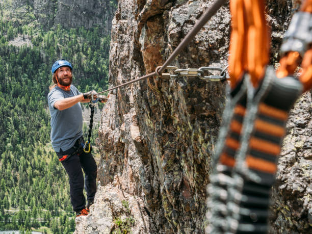istock Man on Via Ferrata climbing up 1284592086