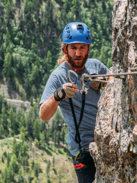 istock Man on Via Ferrata climbing up 1284592314