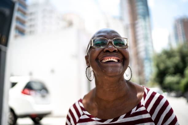 istock Happy senior woman outdoors looking away 1284594786