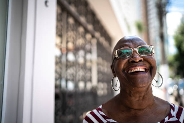 istock Happy senior woman outdoors looking away 1284594843