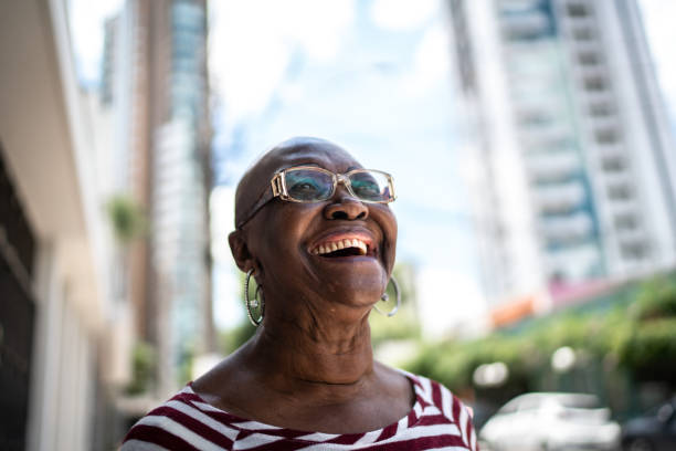 istock Happy senior woman outdoors looking away 1284594909