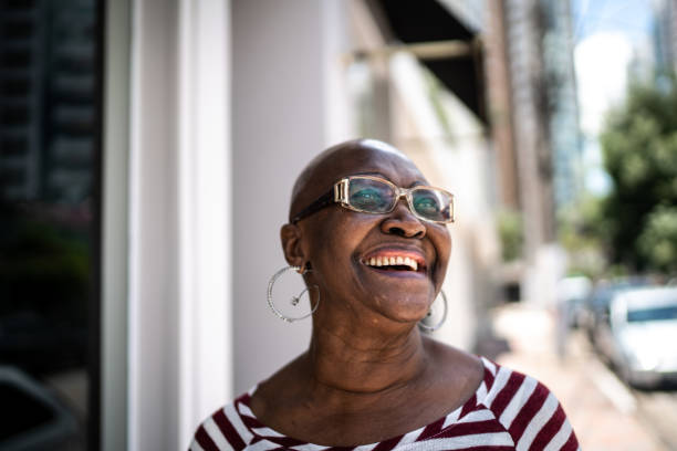 istock Happy senior woman outdoors looking away 1284595461